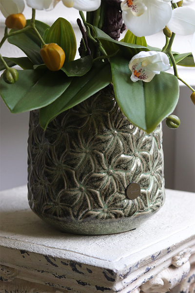 Nedila, sztuczny storczyk w metalowej osłonce